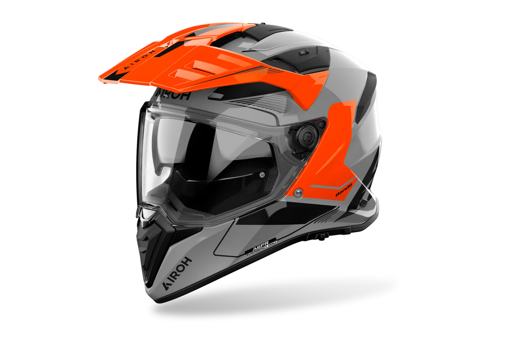Airoh Bandit BADX-X Tune Arancio Lucido (BAT32), casco adventure visto di tre quarti dal lato sinistro, grafica grigia e nera con inserti arancio, lucida
