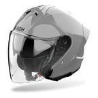 Casco jet Airoh H 21 grigio cemento lucido visto di tre quarti dal lato opposto