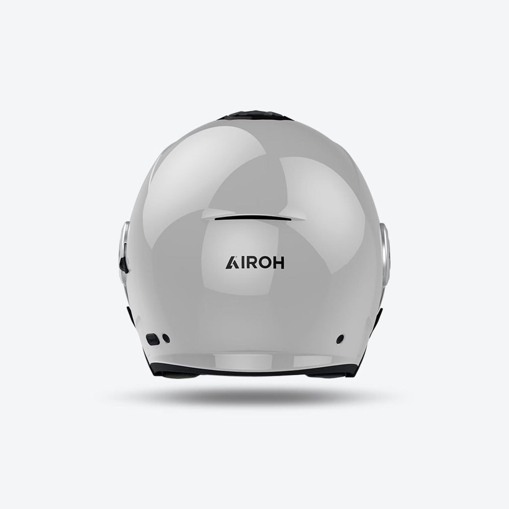 Retro del casco jet Airoh Helyos grigio cemento lucido con logo Airoh in evidenza