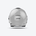 Retro del casco jet Airoh Helyos grigio cemento lucido con logo Airoh in evidenza