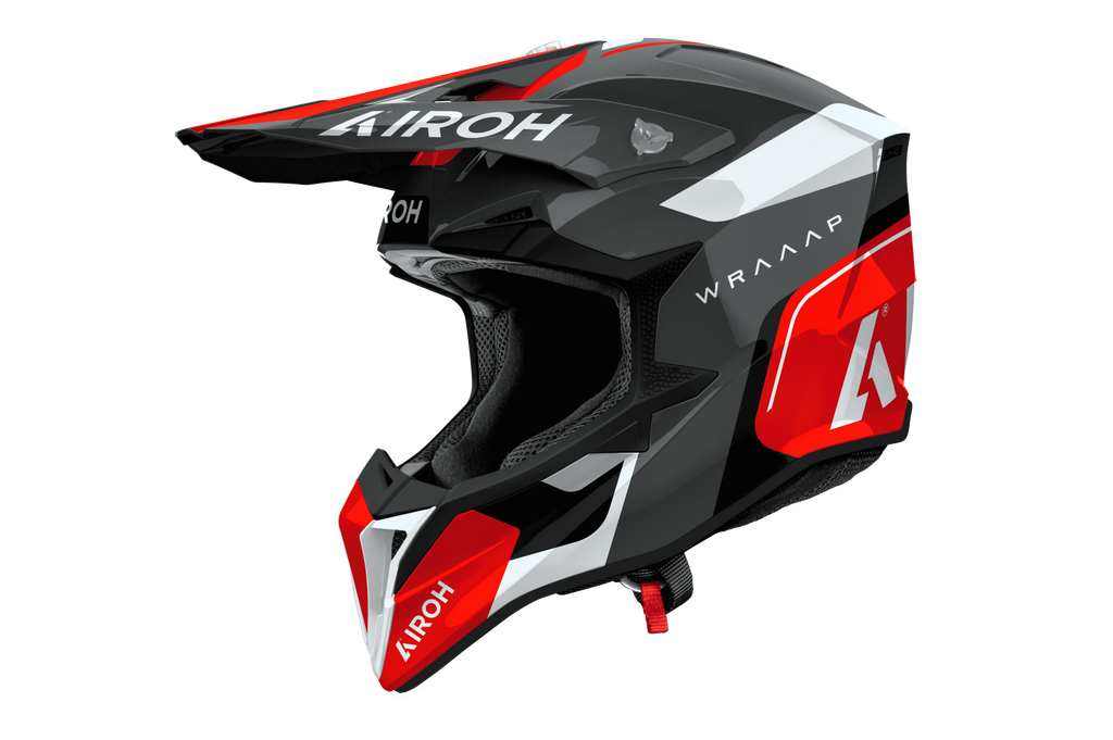 Casco cross Airoh Wraaap Conquer rosso bianco, vista tre quarti anteriore sinistra
