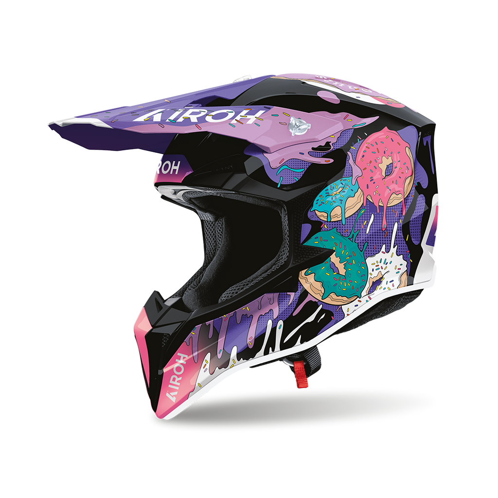 Airoh Wraaap Donuts Nero/Viola Lucido (WRAD17), casco cross visto dal lato sinistro con frontino, nero lucido con grafica viola e ciambelle rosa e azzurre