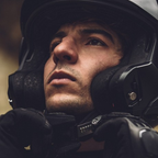 Casco modulare flip-back Kappa KV55 Nero Opaco, indossato in configurazione jet, primo piano frontale del motociclista