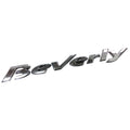 Targhetta laterale cromata originale Piaggio 656743, scritta Beverly in corsivo a rilievo, 166x23 mm, per Beverly 125, 250, 300, 400 e 500